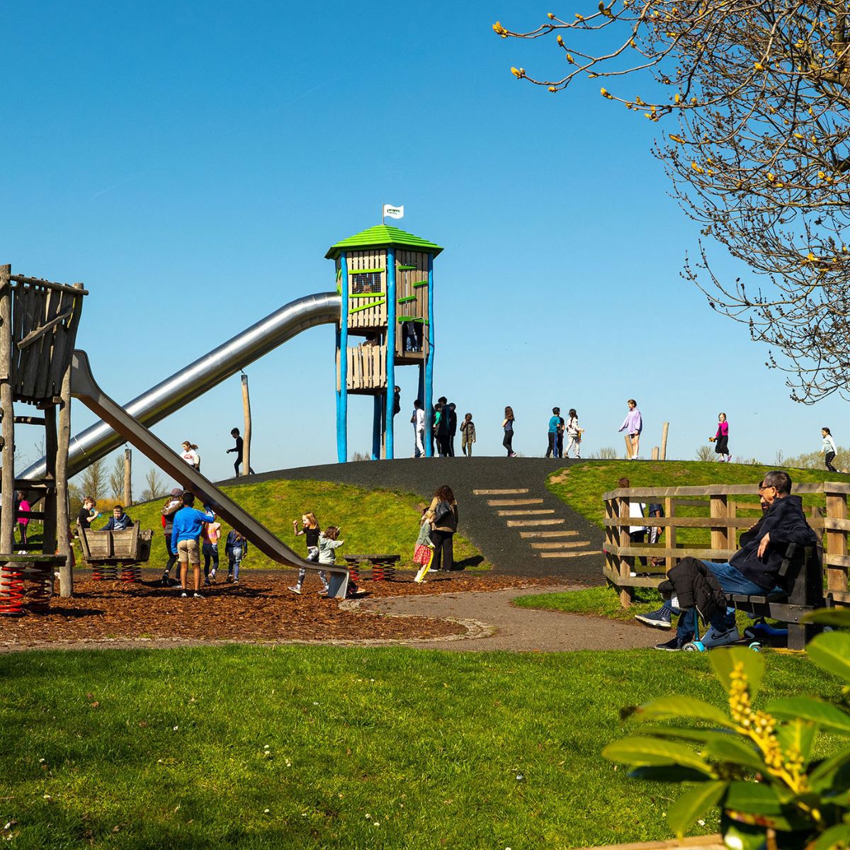 Families playing on the playground at Willen Lake